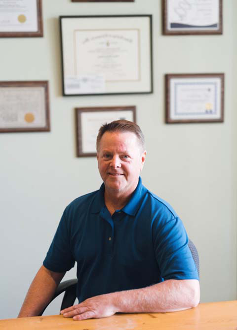 Chiropractor Buellton CA James Neary HP About Us Sitting At Desk